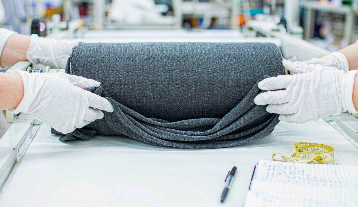 Fabric inspection with measuring tape and inspection report